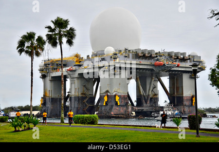The Sea-Based X-Band Radar platform begins to move form Joint Base Pearl Harbor-Hickam March 22, 2013 in Pearl Harbor, Hawaii. The radar system is a key part of anti-missile defense and is undergoing a semi-annual system check at sea. Stock Photo