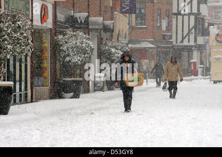 Chesterfield, Derbyshire, UK. 23rd March 2013. 23rd March 2013. Shoppers brave snowy weather, Vicar Lane, Chesterfield, Derbyshire. UK.  Credit:  Matthew Taylor / Alamy Live News Stock Photo