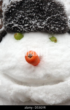 Chesterfield, Derbyshire, UK. 23rd March 2013. 23rd March 2013. Fruit & veg seller, Shirley Haywood builds a snowman using leeks, olives and a carrot on Ibbotsons fruit & vegetable stall, Chesterfield market, Derbyshire. UK  Credit:  Matthew Taylor / Alamy Live News Stock Photo