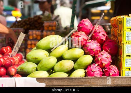 tropical fruits, green mango and dragon fruits on sale in Malaysia. Stock Photo