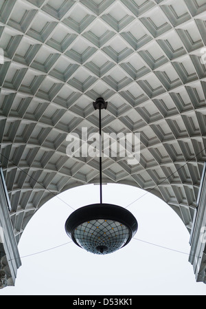 White arch with abstract pattern and big lamp. Donetsk, Ukraine Stock Photo