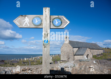Wales Coast Path sign outside Llanbadrig church Isle of Anglesey North Wales UK Stock Photo