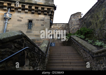 Grand stone staircase inside the Edinburgh Castle in Scotland, with a sign for exhibition inside the Argyle Tower Stock Photo