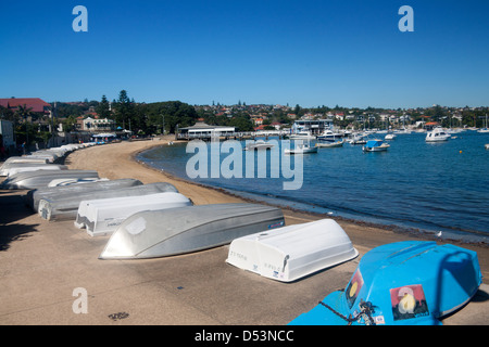 Watsons Bay Beach with upturned boats in foreground Sydney Harbour National Park Sydney New South Wales (NSW) Australia Stock Photo