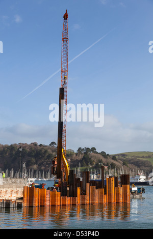 Steel sheets being installed by a pile driver during renovation of the landing slip for the Lower Dartmouth Ferry. Stock Photo