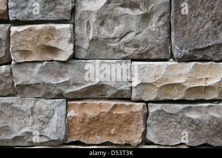 Man made rock, part of a house, to use as a background. An environmentally friendly resource. Stock Photo