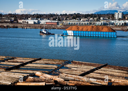 A Tug and Barge on the Fraser River in Vancouver, Canada Stock Photo