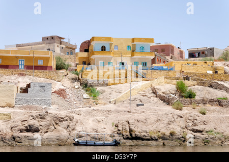 Aswan. Egypt. View of colourful Nubian houses beside the River Nile. Stock Photo