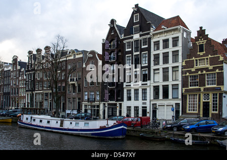 Typical amsterdam buildings on canals, canal-side houses, house on water. horizontal Stock Photo