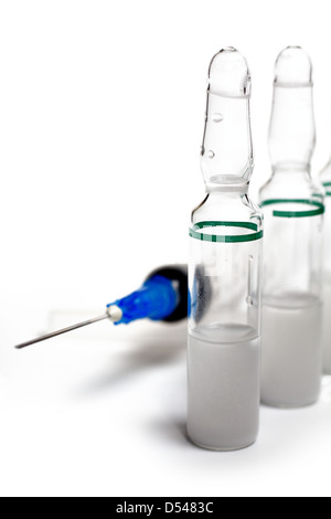 Disposable syringe with needle and vials on white background Stock ...