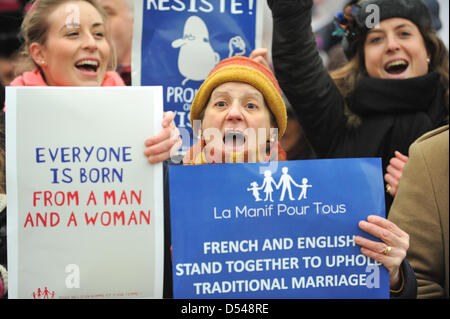 Trafalgar Square, London, UK. 24th March 2013. Protesters hold banners in an anti-gay marriage demonstration in London by British and French people. Credit: Matthew Chattle/Alamy Live News Stock Photo