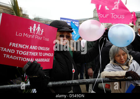 London, UK. 24th March, 2013. Protesters holding banners against gay marriage. French protesters alongside religious groups are organising an Anti-Gay rally in Trafalgar Square.  Anglican Mainstream are urging Christians to turn up to protest Stock Photo