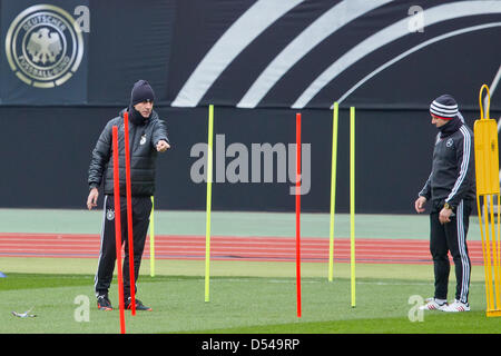 Nuremberg Germany. 24th March, 2013. Coach Joachim Loew (l) and assistant coach Hansi Flick of Germany attend a training session prior to the FIFA World Cup 2014 qualification group C soccer match between Germany and Kazakhstan in Nuremberg Germany, 24 March 2013. The match is played on 26 March 2013 in Nuremberg. Foto: Daniel Karmann/dpa +++(c) dpa - Bildfunk+++ Stock Photo