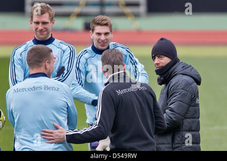 Nuremberg Germany. 24th March, 2013. Per Mertesacker (l-r), Lukas Podolski, goalkeeper Ron-Robert Zieler, goalkeeper coach Andreas Koepke and coach Joachim Loew of Germany attend a training session prior to the FIFA World Cup 2014 qualification group C soccer match between Germany and Kazakhstan in Nuremberg Germany, 24 March 2013. The match is played on 26 March 2013 in Nuremberg. Foto: Daniel Karmann/dpa +++(c) dpa - Bildfunk+++ Stock Photo
