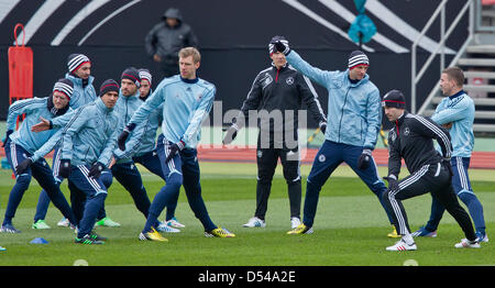 Nuremberg Germany. 24th March, 2013. German team members stretch during a training session prior to the FIFA World Cup 2014 qualification group C soccer match between Germany and Kazakhstan in Nuremberg Germany, 24 March 2013. The match is played on 26 March 2013 in Nuremberg. Foto: Daniel Karmann/dpa +++(c) dpa - Bildfunk+++ Stock Photo