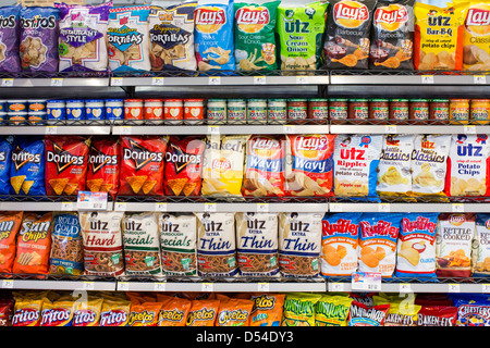 Lay's, Utz and Doritos potato chips on display at a Walgreens Flagship ...