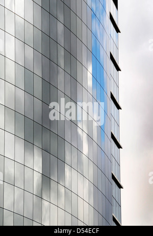 The side of an office building made of reflective glass Stock Photo