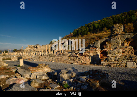 Basilica stoa royal porch at the state Agora with the Odeon at left and gymnasium at right in ancient Ephesus Turkey Stock Photo