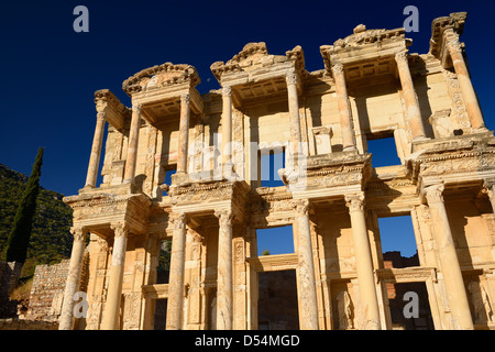 Morning sun on the ruins of the facade of the Roman Library of Celsus in ancient Ephesus Turkey with clear blue sky Stock Photo
