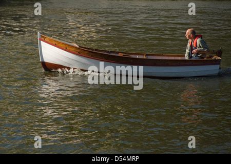 Man in a small motorboat, Bristol harbour, England, UK Stock Photo