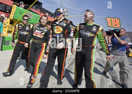 Fontana, California, USA. 24th March 2013. March 25, 2013 - Fontana, California, U.S - Crew members from competing teams escort an angry Tony Stewart back to his pit after a post-race altercation with Joey Logano at the Auto Club 400 NASCAR race in Fontana. (Credit Image: Credit:  Daniel Knighton/ZUMAPRESS.com/Alamy Live News) Stock Photo