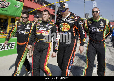 Fontana, California, USA. 24th March 2013. March 25, 2013 - Fontana, California, U.S - Crew members from competing teams escort an angry Tony Stewart back to his pit after a post-race altercation with Joey Logano at the Auto Club 400 NASCAR race in Fontana. (Credit Image: Credit:  Daniel Knighton/ZUMAPRESS.com/Alamy Live News) Stock Photo