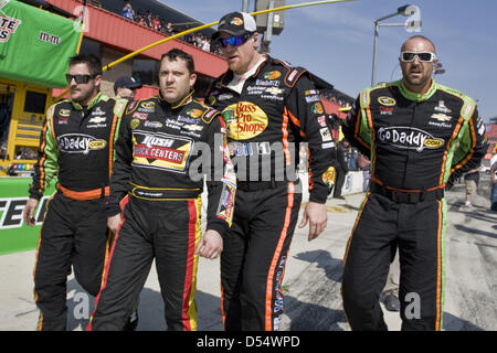 Fontana, California, USA. 24th March 2013. March 25, 2013 - Fontana, California, U.S - Crew members from competing teams escort an angry Tony Stewart back to his pit after a post-race altercation with Joey Logano at the Auto Club 400 NASCAR race in Fontana. (Credit Image: Credit:  Daniel Knighton/ZUMAPRESS.com/Alamy Live News) Stock Photo