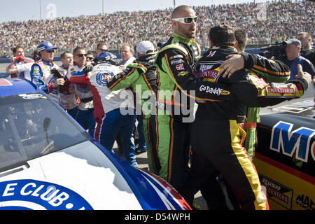 Fontana, California, USA. 24th March 2013. March 24, 2013 - Fontana, California, U.S - TONY STEWART (L) and JOEY LOGANO are separated by pit crew members after they got into a shoving match at the end of the Auto Club 400 NASCAR Sprint Cup Series race. Logano blocked Stewart's attempt to pass on the final restart of the race in Fontana. (Credit Image: Credit:  Daniel Knighton/ZUMAPRESS.com/Alamy Live News) Stock Photo