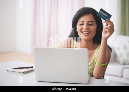 Woman doing online shopping with a laptop Stock Photo