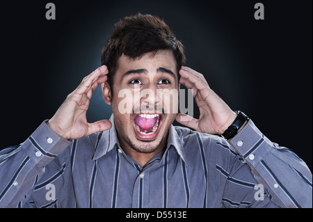 Close-up of a frustrated businessman shouting Stock Photo
