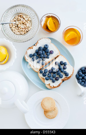 Toast with blueberries, nuts and tea Stock Photo