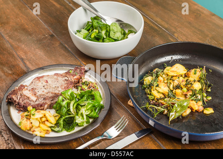 Meat, vegetables and potatoes on table Stock Photo