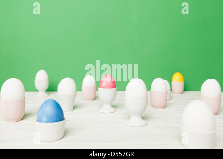 Colorful Easter eggs in egg cups Stock Photo