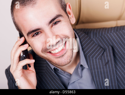 Handsome businessman talking on the cellphone Stock Photo