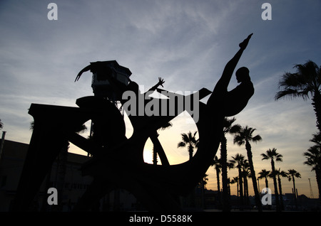 Silhouette of a metal sculpture called Tribute to the swimming made by Alfredo Lanz from the year 2004 Stock Photo