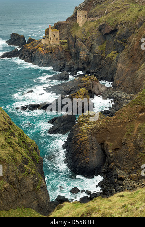 The cliffs around the Botallack Tin Mines, Cornwall. This image shows 2 of the engine houses in context, among the steep cliffs Stock Photo