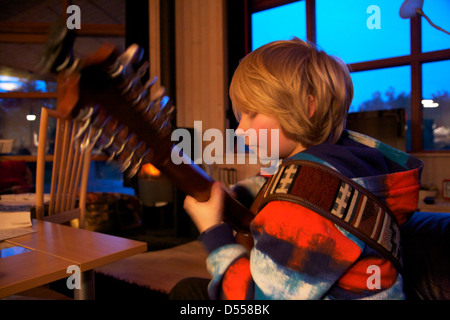 Boy playing guitar Stock Photo