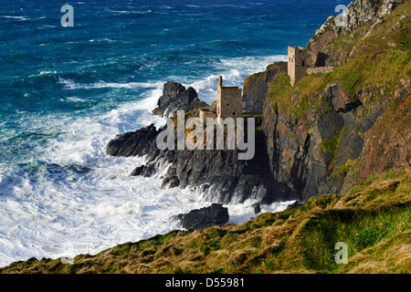 An abondoned tin mine perched on a cliff face near Botallack, Cornwall Stock Photo