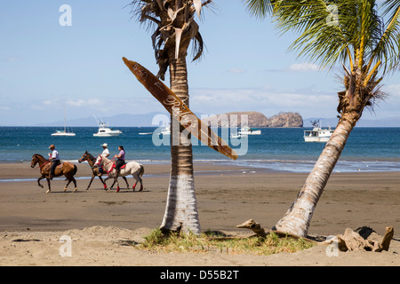 Riding horses along the shores of Playas del Coco, Guanacaste Province, Costa Rica.
