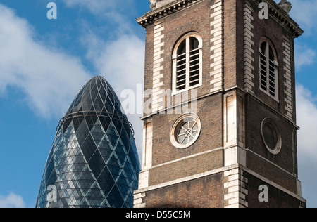 30 St Mary Axe (Gherkin or Swiss Re Building) Skyscraper and Tower of St Botolph-Without-Aldgate Church, London, England, UK Stock Photo