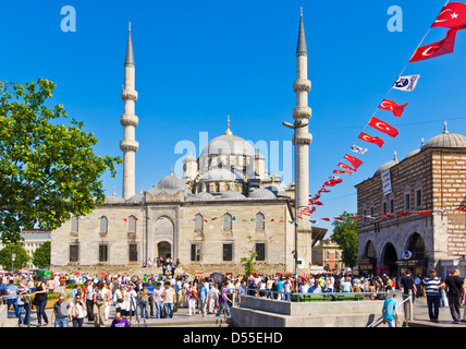 Yeni Cami (New Mosque) and Turkish flags, Eminonu, Istanbul, Turkey Stock Photo