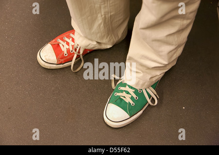 Berlin, Germany, the man with the brand Converse sneakers in two different colors Stock Photo