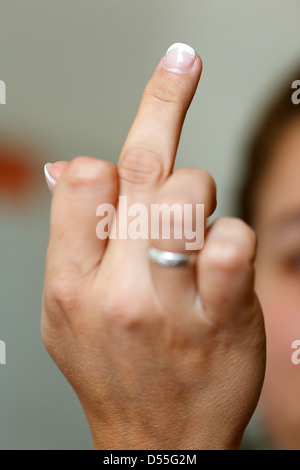 Berlin, Germany, woman showing middle finger Stock Photo