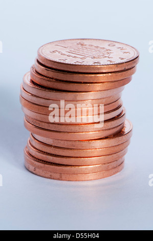 Close-up of new shiny coppers or pennies (British unit of currency 1p coins) in small pile, tails up & totalling small amount of 14p - England, GB, UK Stock Photo