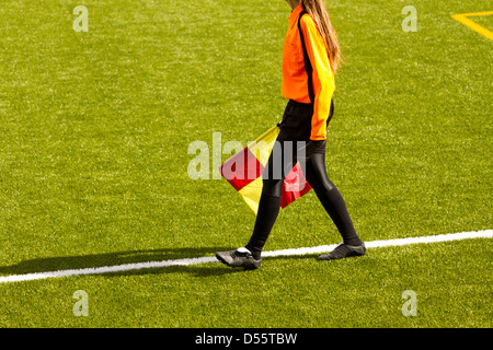 Female soccer referee hold the flag during a match Stock Photo