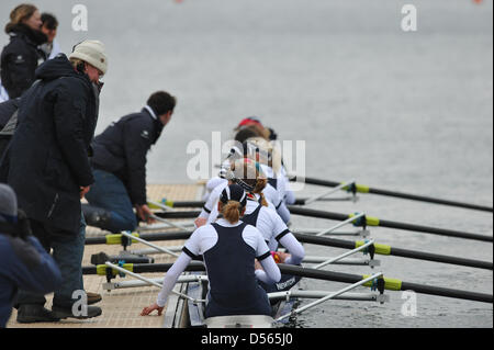 Eton Dorney, UK. 24th March 2013. The crew of the Oxford blue boat arrive at the boat house jetty after winning The Newton Women's University Boat Race. Although Cambridge took an early lead, Oxford fought back to win by 1.75 lengths in 7m21s. Credit: Michael Preston / Alamy Live News Stock Photo