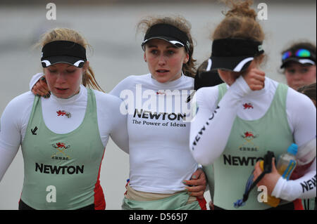 Eton Dorney, UK. 24th March 2013. Looking very tired, and in tears, the crew of the Cambridge blue boat make their way to the boat house after losing The Newton Women's University Boat Race. Despite taking an early lead, in the end, Cambridge lost to Oxford by 1.75 lengths in 7m21s. Front row are, left to right: Fay Sandford, Caroline Reid, Holly Game. Credit: Michael Preston / Alamy Live News Stock Photo