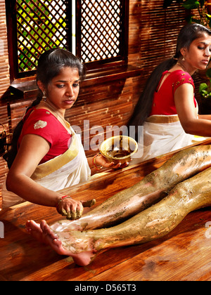 Young woman having feet Ayurveda spa massage. Stock Photo