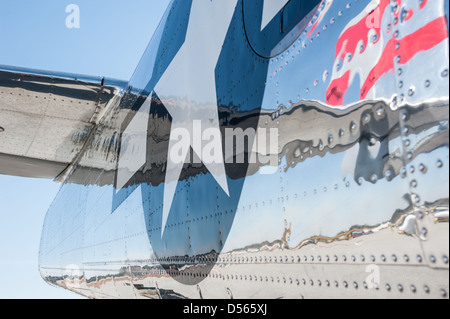 Polished chrome on the tail section of a World War II era Mitchell B-25 Bomber at a Columbus, Georgia air show. Stock Photo