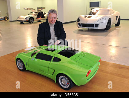 Peter Melkus, technical director of Melkus Sportwagen GmbH, poses at a model of the RS 2000 in front of a RS 1000 from the 1960s in the Kunsthalle im Lipsiusbau in Dresden, Germany, 10 March 2010. 25 RS 2000 sports cars shall be sold annually for 107.000 euros. The State Art Collections Dresden presents sketches, models and originals in the special exhibition 'Melkus, die ideale Li Stock Photo